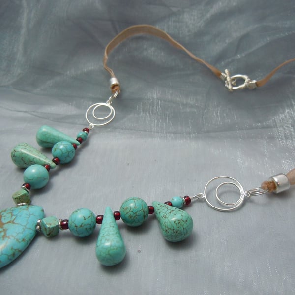 Necklace of assorted shapes of Turquoise beads with glass beads & ribbon