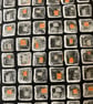 A pair of grey black and orange combo piped cushion covers. Zipped on one side. - Image 3
