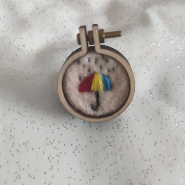 Umbrella hoop pin badge