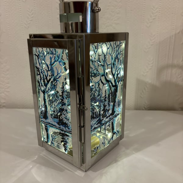 A hand painted and fired metal and glass lantern by Andrew Jenkins