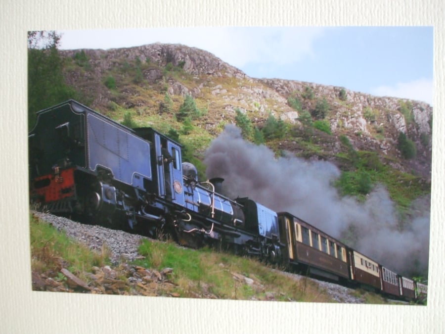 Photographic greetings card of a Welsh Highland Railway steam train in black.