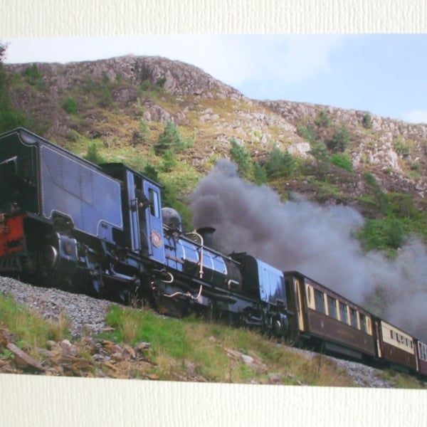 Photographic greetings card of a Welsh Highland Railway steam train in black.