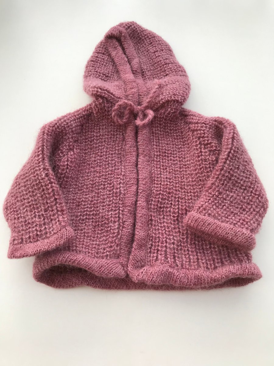 Hand knitted baby jacket with hood