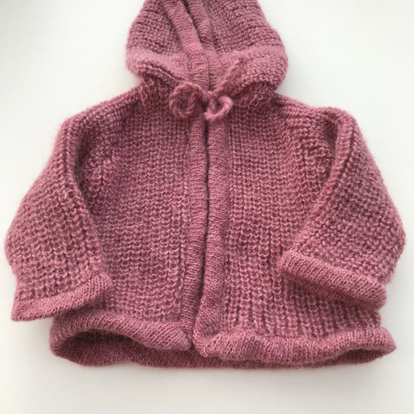 Hand knitted baby jacket with hood