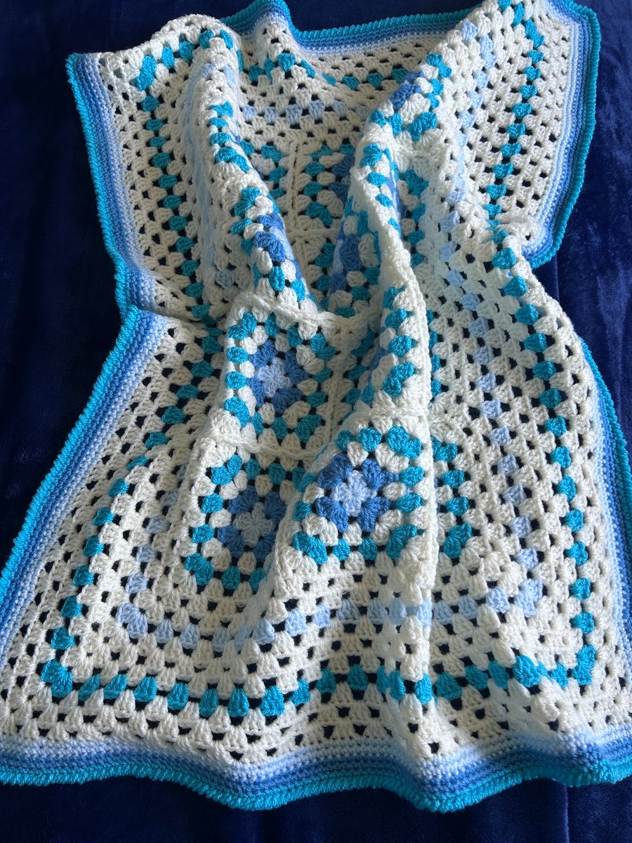 Small crocheted blue and cream blanket 