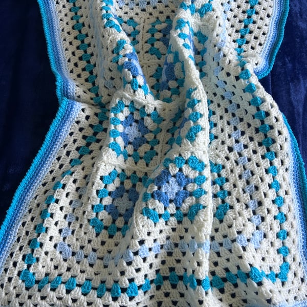 Small crocheted blue and cream blanket 