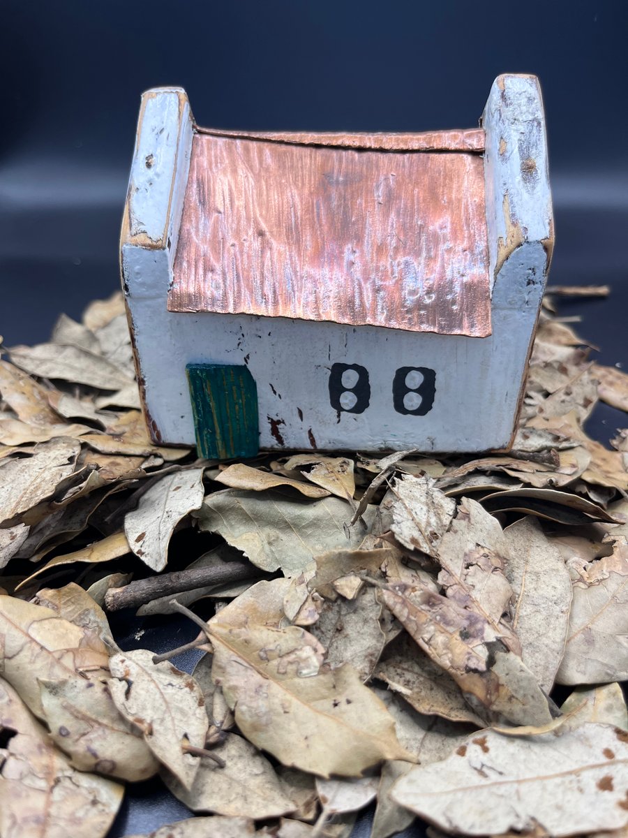 Wooden copper roofed miniature house 