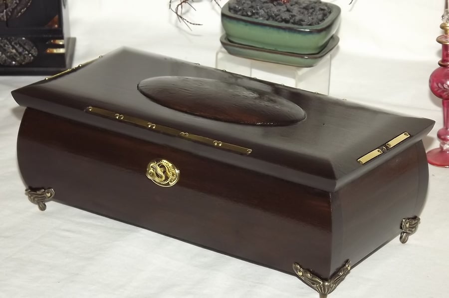 Mahogany and Brass lockable deluxe wooden box with claw feet and brass inlay.