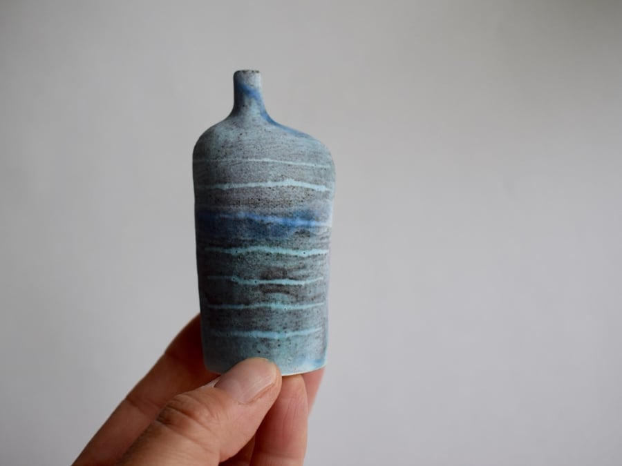 Tracks Bottle Slip Decorated onto Stoneware Ceramic