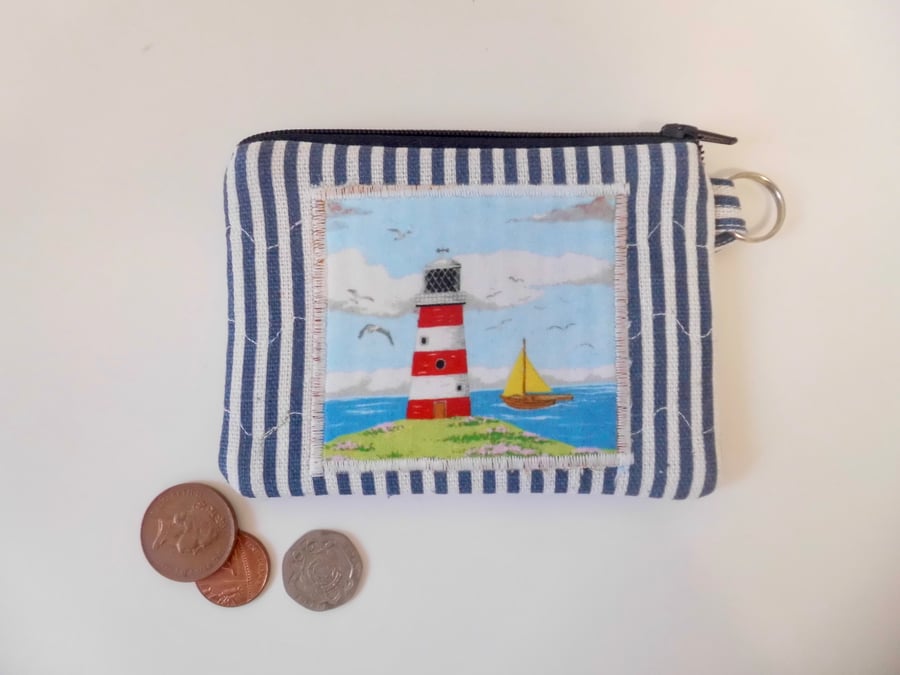 Coin purse lighthouse and sail boat coastal scene make up