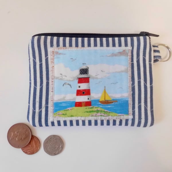 Coin purse lighthouse and sail boat coastal scene make up