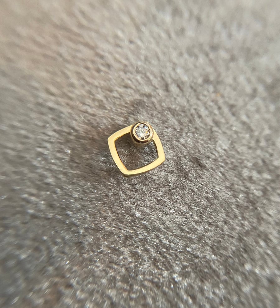 Single ear stud genuine diamond earring set in 9ct yellow gold.