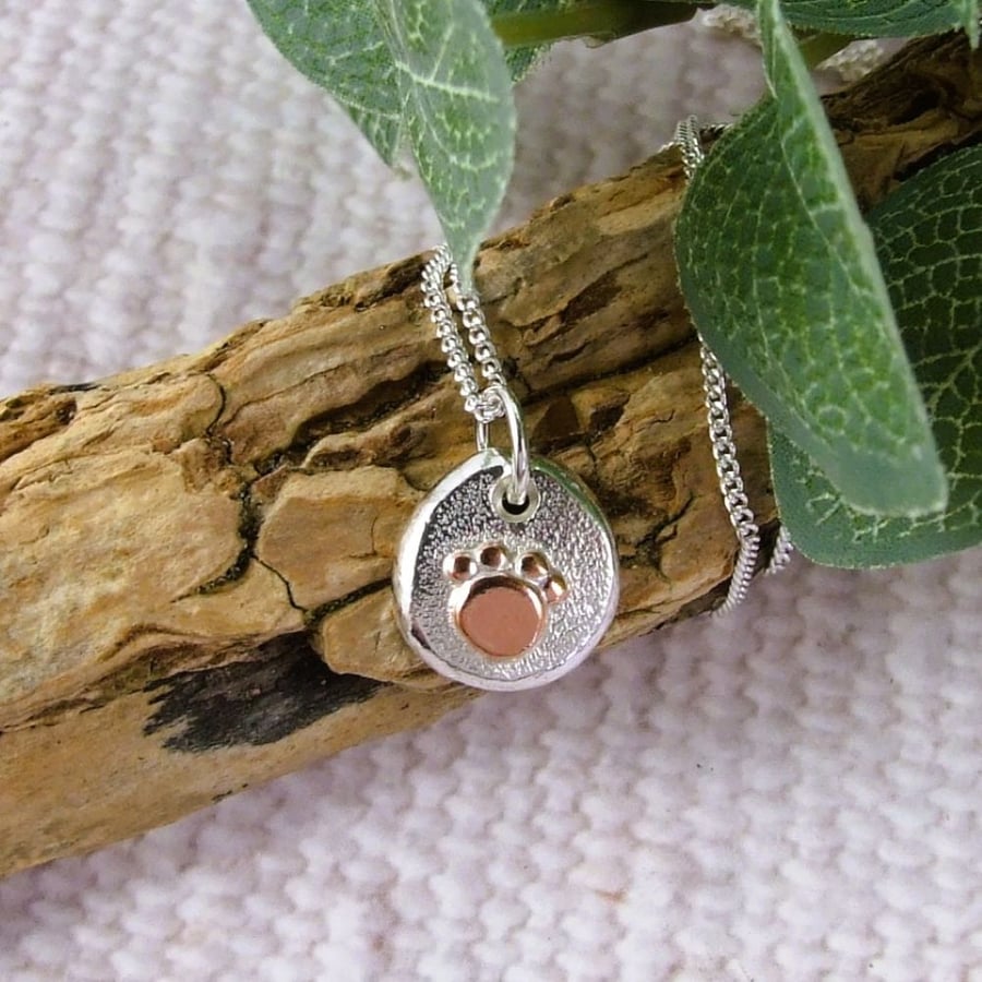 Silver Pebble Necklace with Copper Paw Print