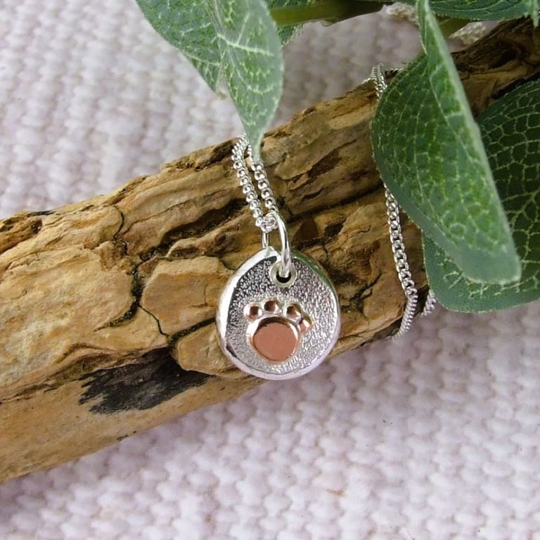 Silver Pebble Necklace with Copper Paw Print