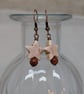 Cream howlite star and goldstone bead earrings with copper ear wires - Image 2