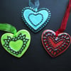 Set of three ceramic heart decorations