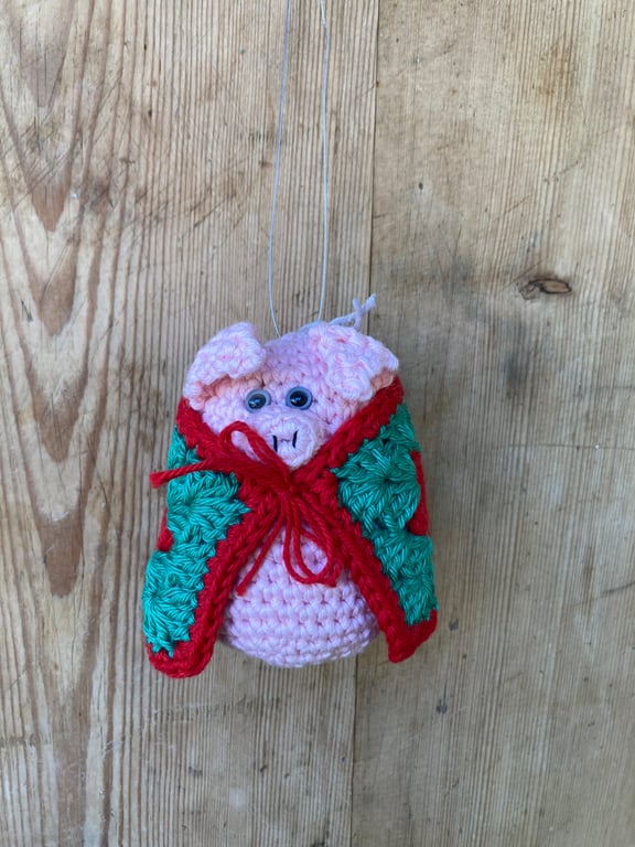 Crochet pig in blanket