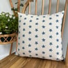 Cushion cover in taupe with navy starfish print, 36cm x 36cm. 
