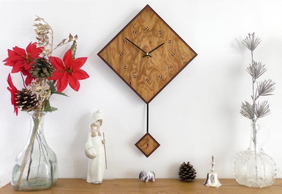 Diamond Pendulum Wall Clock In Olive Wood and Black Walnut with Inlaid Markers.
