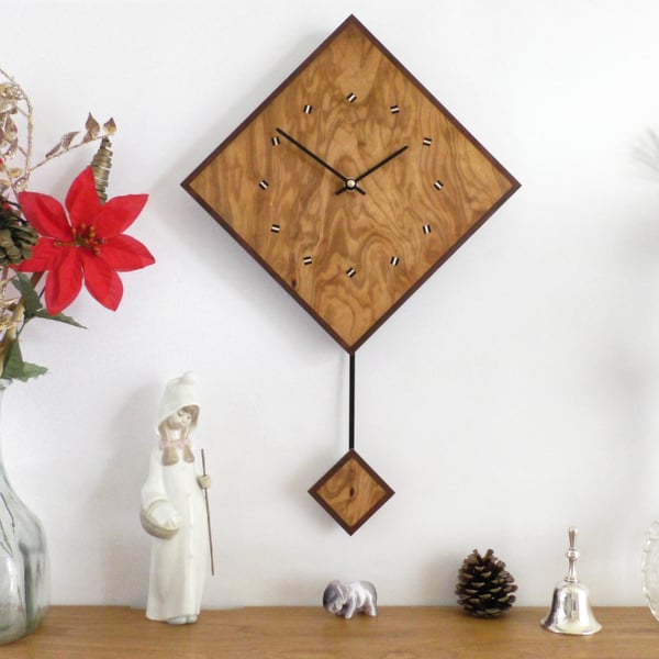Diamond Pendulum Wall Clock In Olive Wood and Black Walnut with Inlaid Markers.