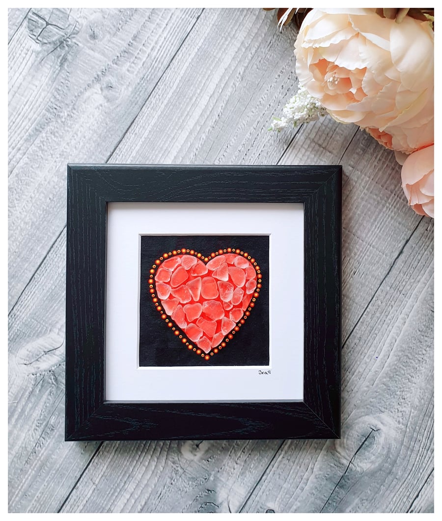 Seaglass mosaic heart on black painted background