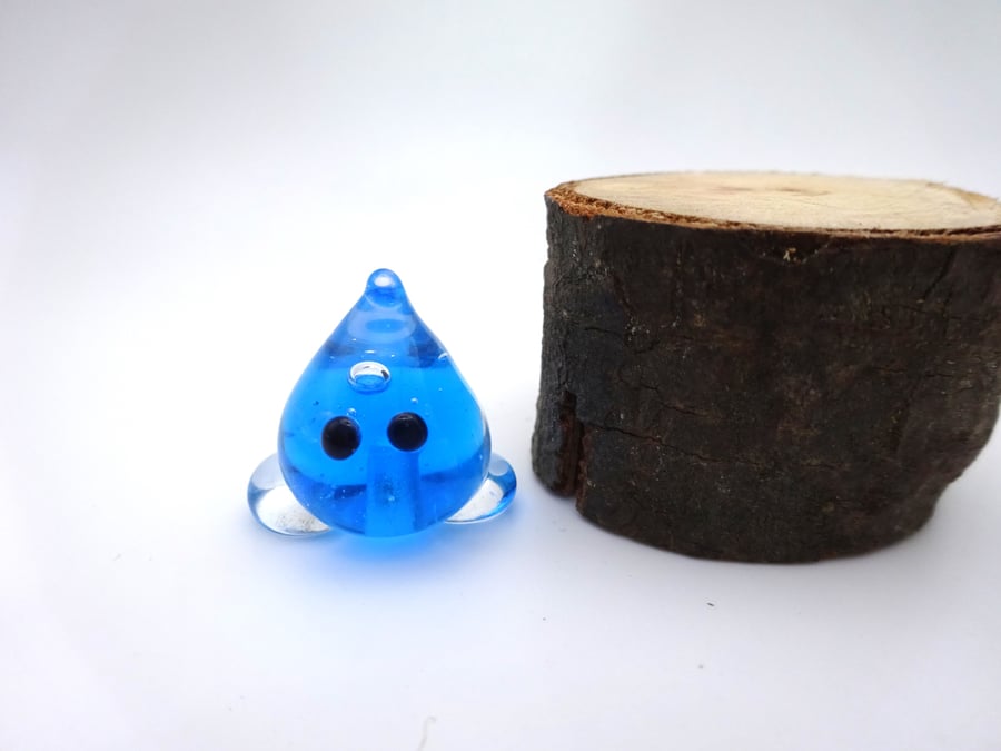 small glass wisp figure