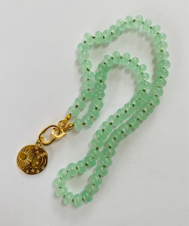 Minty green glass rondelle necklace with celestial pendant