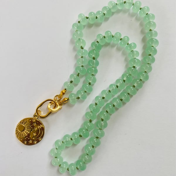 Minty green glass rondelle necklace with celestial pendant
