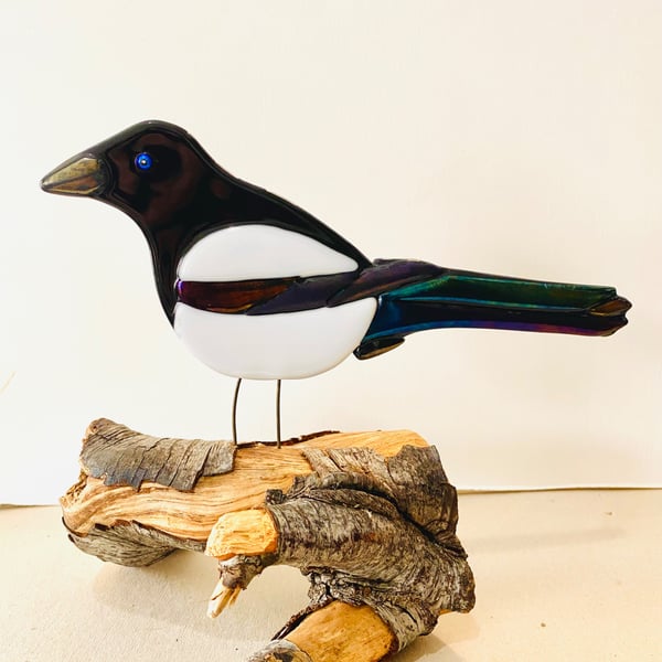Fused glass magpie ornament on a Natural log stand 
