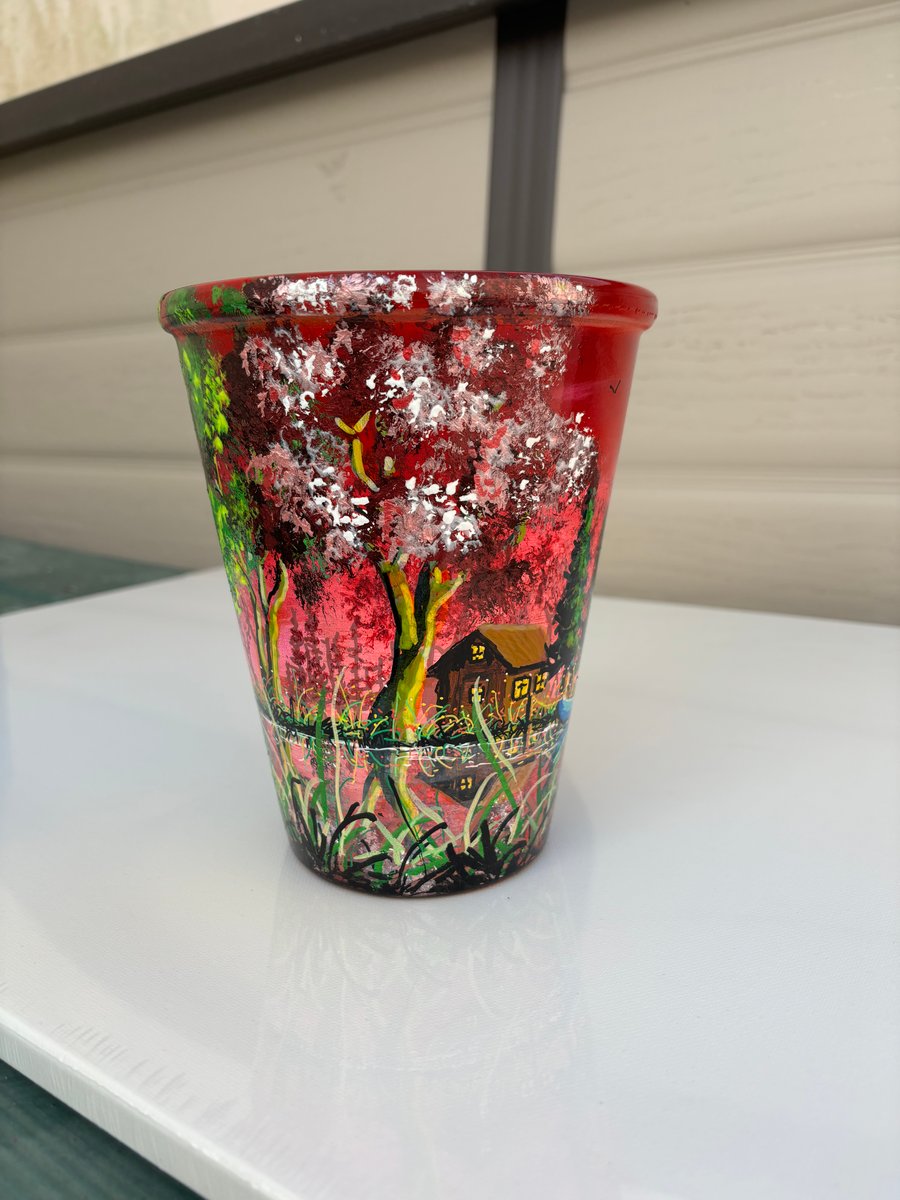 A hand painted and sealed ceramic pot by Andrew Jenkins 