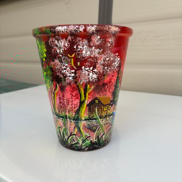 A hand painted and sealed ceramic pot by Andrew Jenkins 