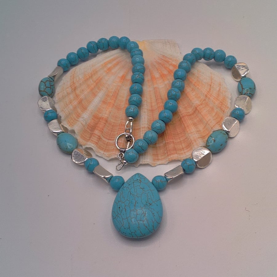 Turquoise Teardrop Pendant on an Turquoise and Silver Beaded Necklace