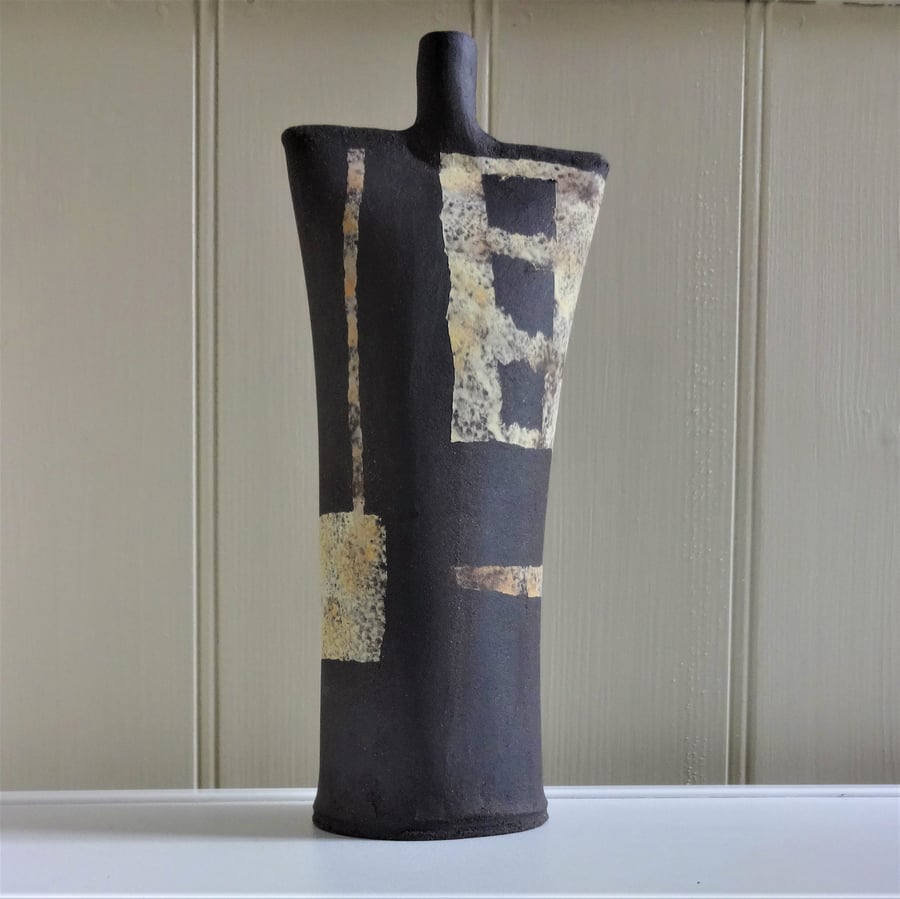 Ceramic abstract art sculpture, lemon, yellow panels and stripes on black clay