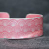 Geometric shell pattern cuff bracelet coral