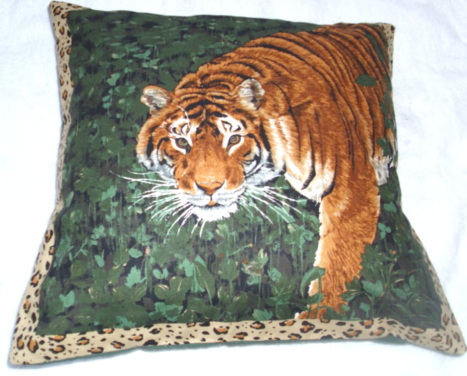 On Safari magnificent Tiger emerging from a forest cushion
