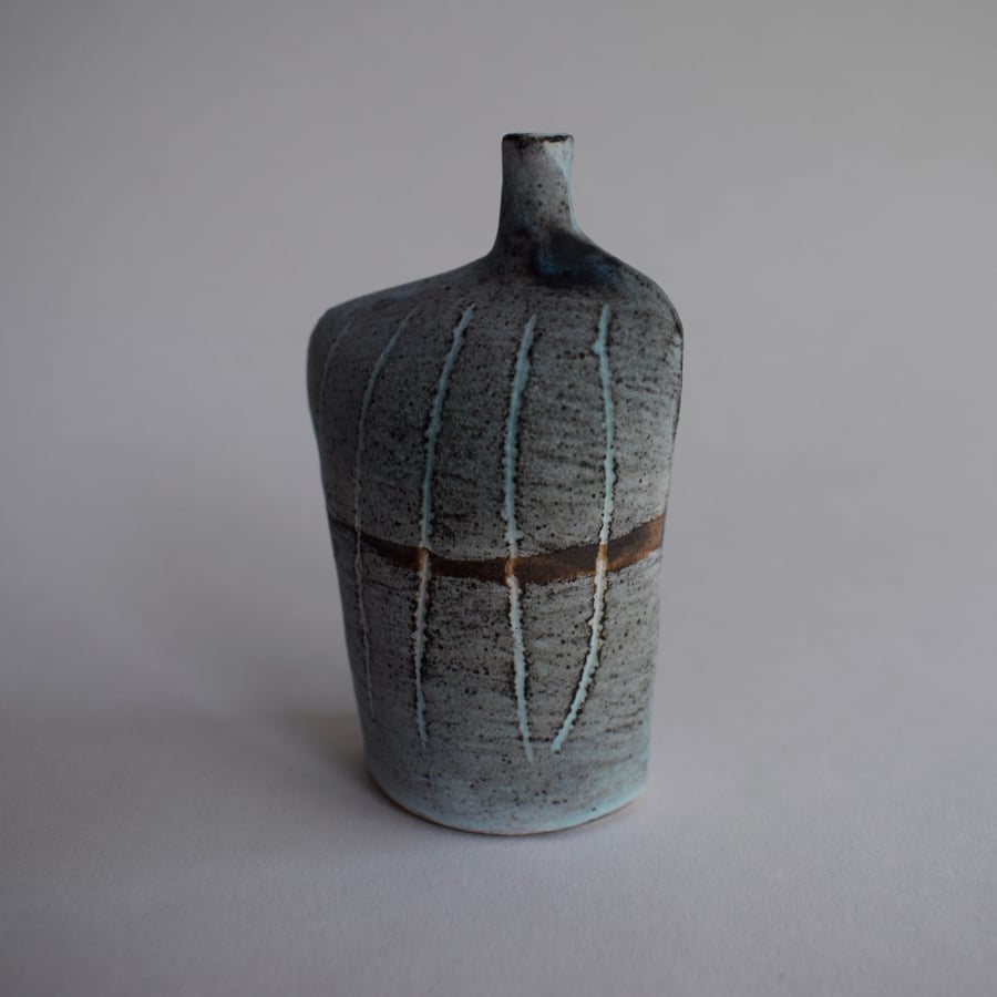 Tracks Bottle Slip Decorated onto Stoneware Ceramic