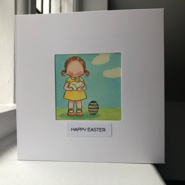 Easter Card girl holding a rabbit with easter egg