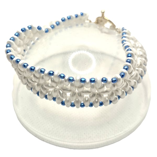 Ladies white beaded bracelet with blue faux pearls