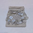 Button bracelet with silver glitter and pearlescent buttons and toggle clasp 