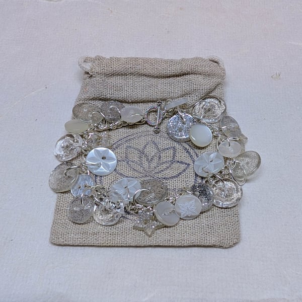 Button bracelet with silver glitter and pearlescent buttons and toggle clasp 