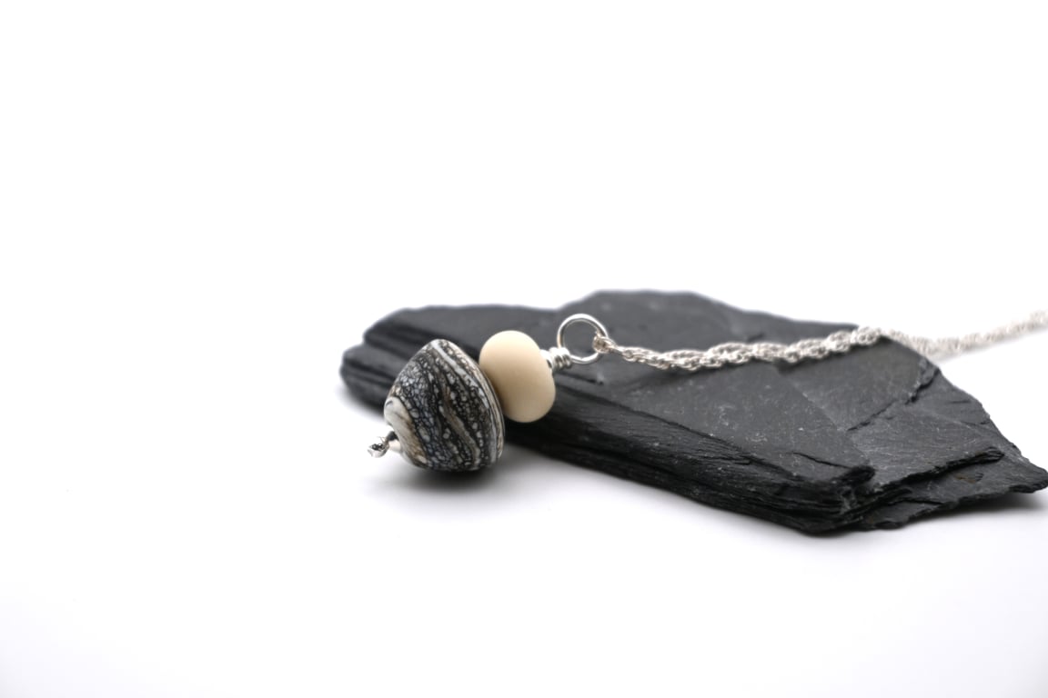 black mottled lampwork glass cone pendant necklace