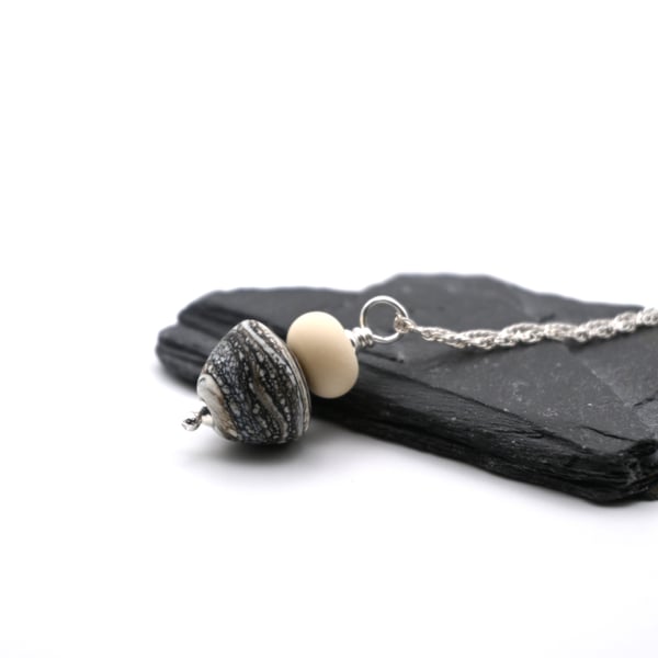 black mottled lampwork glass cone pendant necklace