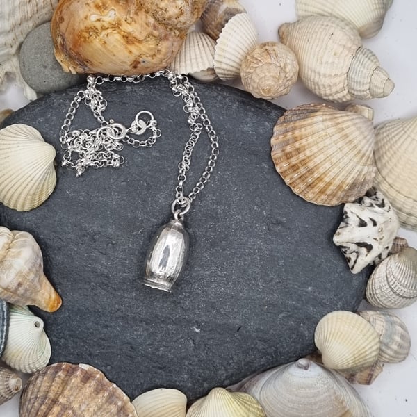 Real poppy seed preserved in silver pendant necklace