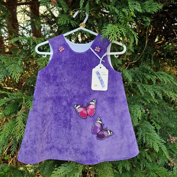 Age: 6-12m Purple Butterfly Needlecord dress. 