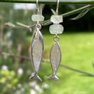 Silver and aquamarine mismatched fish earrings.
