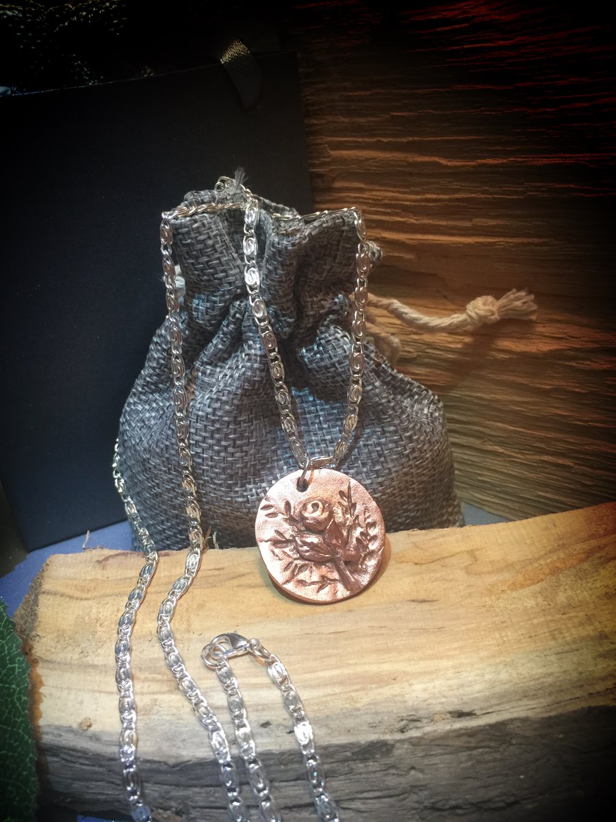Hand sculpted copper 3d rose design disc pendant on 20” 925 sterling silver 