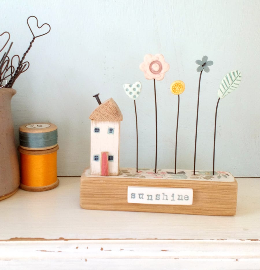 Little wooden house with clay and button flower garden 'sunshine'