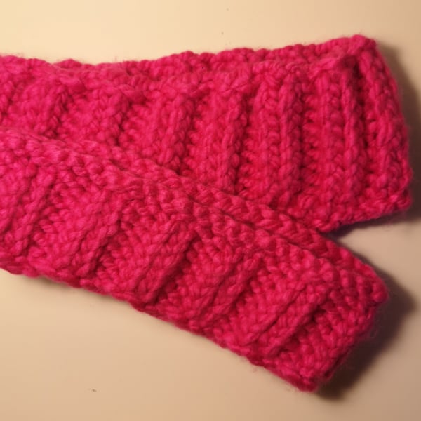 Handknitted hot pink ribbed ear warmer