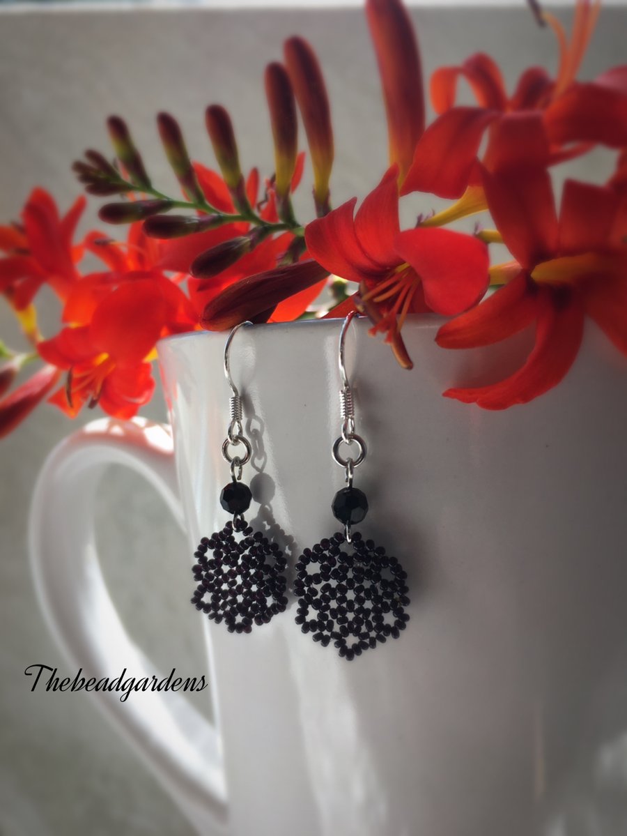 Flat black flower earrings 