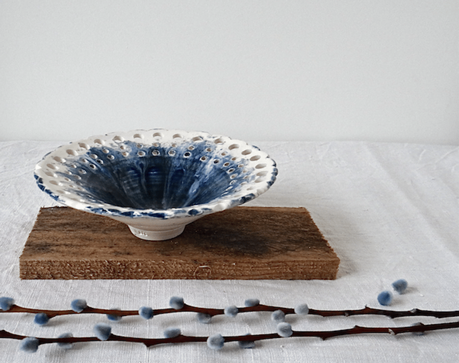 Decorative handmade ceramic dish bowl with pierced rim in blue and white